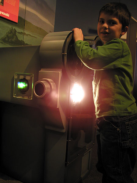 little man manning the projector