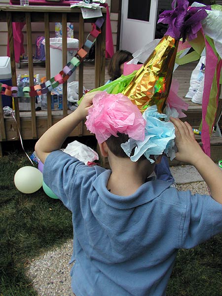 the little man, trying to blend in wearing princess hat