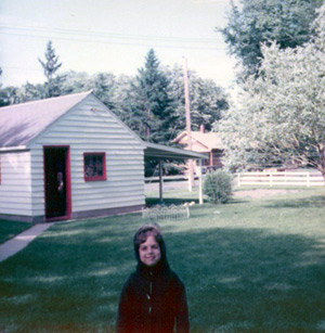 Tom in the backyard, near the garage