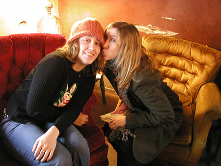 pretty ladies kissing at pandora's cup