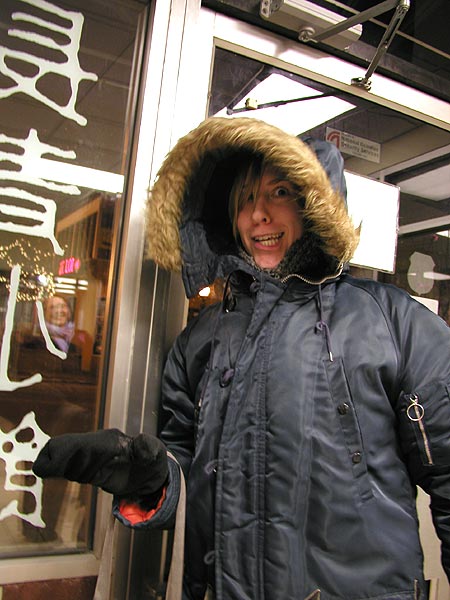 ellen in her new parka, maria in the reflection